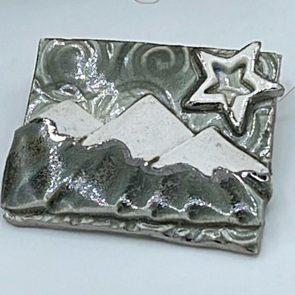 Artisan made ceramic mountain scene brooch